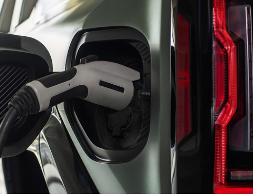 Close up of charging port with charger plugged in on a GMC Hummer EV SUV - Doug Henry GMC in FARMVILLE NC