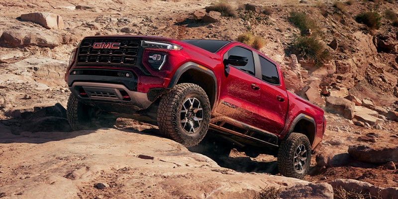 2024 GMC Canyon at Doug Henry GMC driving up rocks